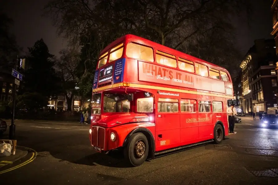 The festival Routemaster parked on Soho Square at night