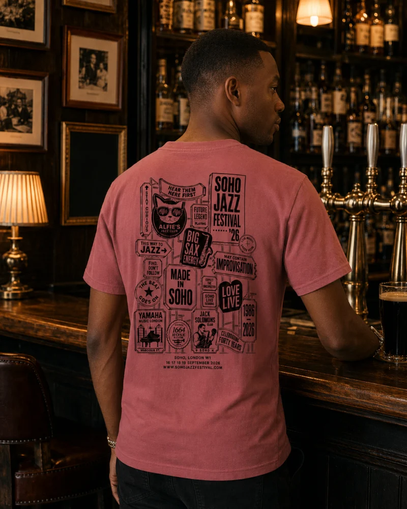 Soho Jazz Festival 2026 tee in watermelon, back print, worn at a Soho bar