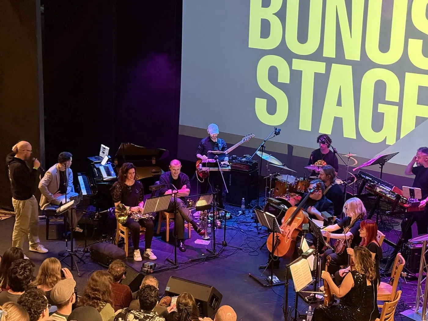 Bonus Stage live games music concert, full band on stage in front of an audience